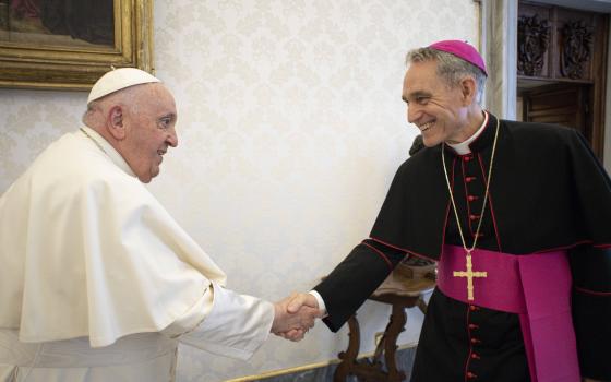 Pope Francis meets Archbishop Georg Gänswein, personal secretary to the late Pope Benedict XVI, in the library of the Apostolic Palace at the Vatican May 19, 2023. Although he still has the title of prefect of the papal household, Archbishop Gänswein has not worked in the office since 2020 and is awaiting a new assignment. (CNS photo/Vatican Media)