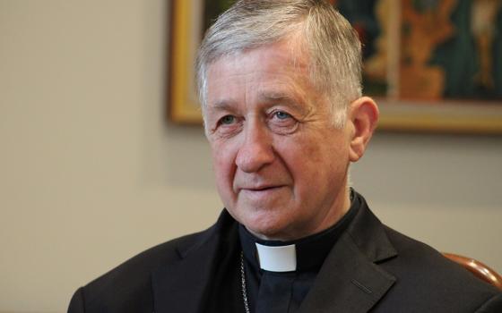 Chicago Cardinal Blase Cupich listens to a Ukrainian refugee family talk during a July 1, 2023, visit at the Basilian Sisters' monastery in Lviv, Ukraine. Cupich spoke Sept. 26 at Fordham University to commemorate Cardinal Joseph Bernardin's "consistent ethic of life" speech in 1983. (OSV News/Gina Christian)