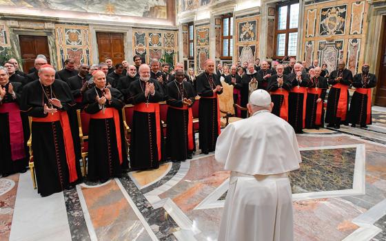 Pope Francis meets members of the Dicastery for the Doctrine of the Faith in the Apostolic Palace at the Vatican Jan. 26, 2024. In the front row from left are: Cardinals Christoph Schönborn, Robert Prevost, Seán O'Malley, Peter Turkson, Victor Manuel Fernández, Claudio Gugerotti, Marc Ouellet, Fernando Filoni, John Onaiyekan and Stephen Mulla. (CNS/Vatican Media)