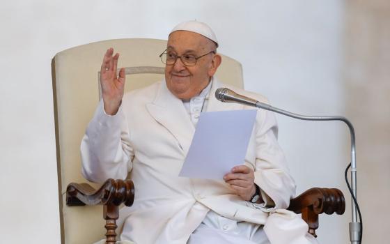 Pope Francis greets visitors while he makes brief remarks at the end of his weekly general audience in St. Peter's Square at the Vatican on March 6.