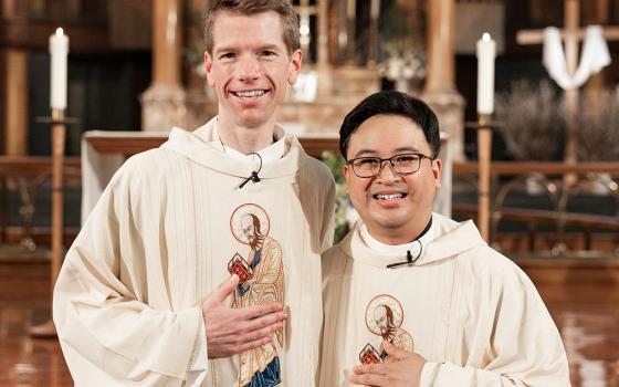 Paulists Fr. Chris Lawton and Fr. Dan Macalinao are pictured after their ordination Mass,  at St. Paul The Apostle Church on May 18 in New York City. (Courtesy of Zachera Wollenberg)