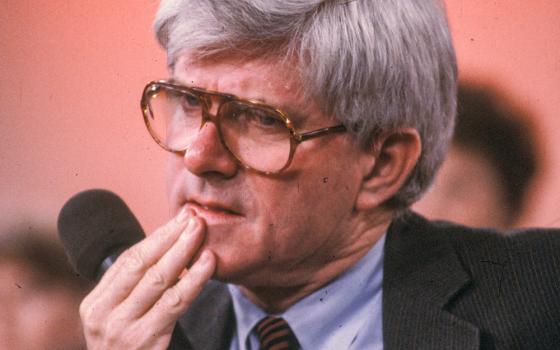 Phil Donahue listens on his television talk show in an undated photo. (Newscom/ZUMAPRESS.com/Al Stephenson)