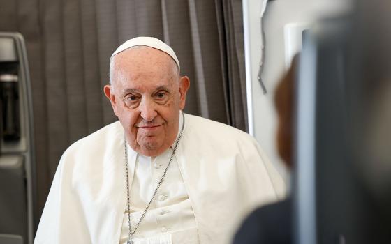 Pope Francis listens to a question from a journalist aboard his flight back to Rome Sept. 13, after visiting Indonesia, Papua New Guinea, Timor-Leste (or East Timor) and Singapore. It was his 45th and longest foreign trip. (CNS photo/Lola Gomez)