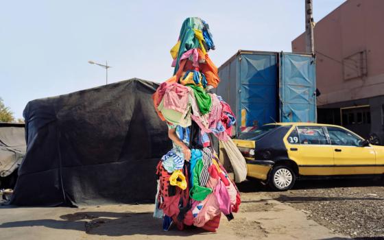 A creation of performance artist Jeremy Hutchison, the clothing "zombie" was seen walking around Manhattan during New York Fashion Week. The project aims to raise awareness about clothing waste in the fashion industry. (Dani Pujalte)