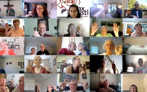 People exchange the sign of peace during a Mass celebrated Sept. 7 as part of Pax Christi USA's annual national conference, held virtually and attended by more than 200 Catholic peace and social justice advocates from across the country and the world. (NCR screenshot/YouTube/PaxChristUSA)