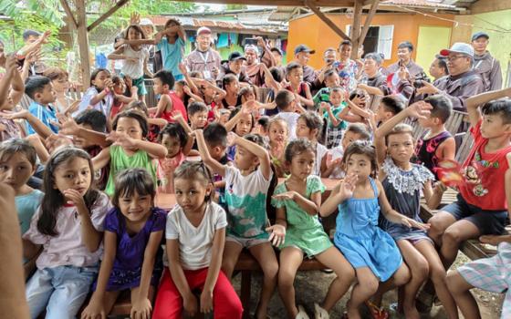 Children from the adopted community in Lapu-Lapu City, Mactan Island, Cebu, Philippines, gather at the makeshift venue for tutorials, catechesis and meals. (Courtesy of Franciscan Sisters of the Immaculate Conception of the Holy Mother of God)