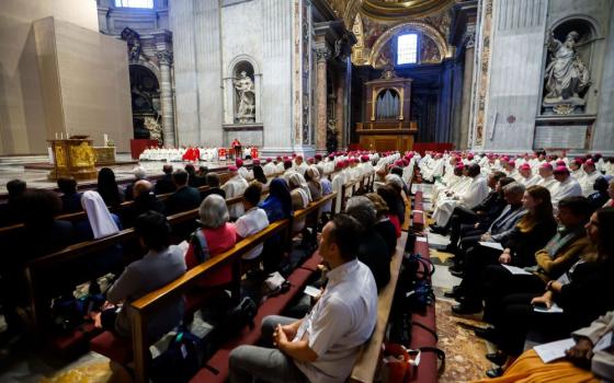 Cardinal Mario Grech, secretary-general of the synod, delivers his homily during Mass with synod participants at the Altar of the Chair in St. Peter’s Basilica at the Vatican, Oct. 21. 