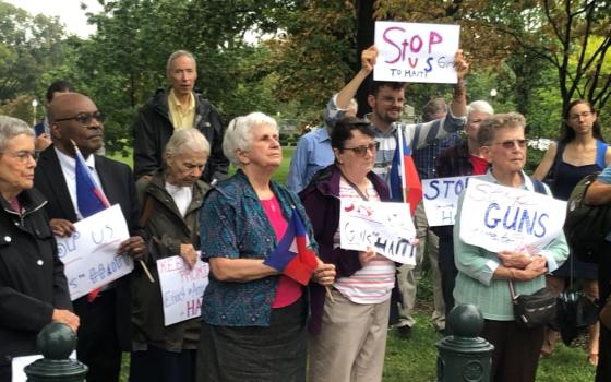 Advocates from sister congregations and peace groups concerned about arms trafficking into Haiti gather outside U.S. Senate office buildings Sept. 27. 