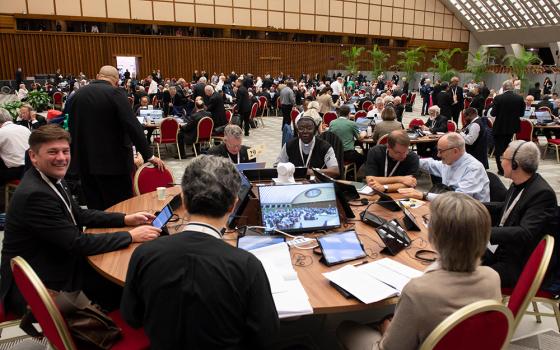 Archbishop Timothy Broglio of the U.S. Archdiocese for the Military Services sits at one of the English-language tables during the Synod of Bishops on synodality in the Paul VI Audience Hall at the Vatican Oct. 22, 2024. (CNS/Vatican Media)