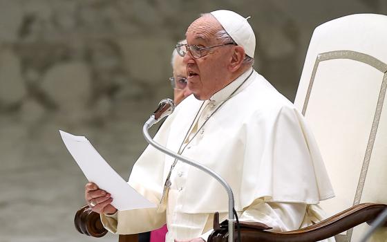 Pope Francis talks to visitors during his weekly general audience in the Paul VI Audience Hall at the Vatican Dec. 11, 2024. (CNS/Lola Gomez)