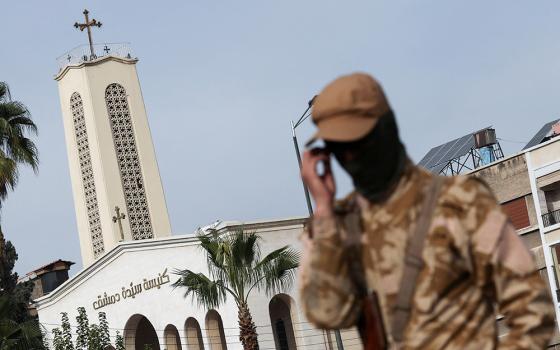 A rebel fighter guards the street in front of Lady of Damascus Church in Syria Dec. 11, 2024, after rebels seized the capital and ousted Syria's Bashar al-Assad. (OSV News/Reuters/Amr Abdallah Dalsh)