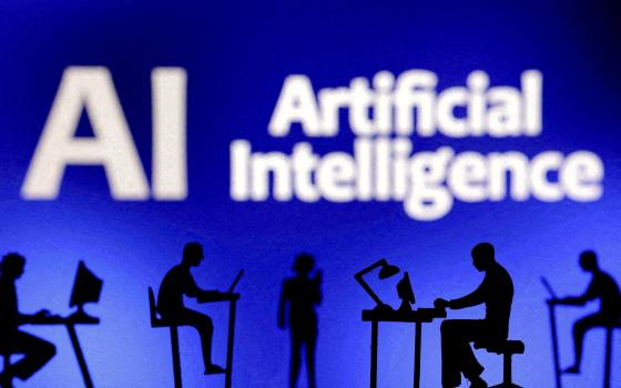 Figurines with computers and smartphones are seen in front of the words "AI Artificial Intelligence" in this Feb. 19, 2024, illustration. (OSV News illustration/Dado Ruvic, Reuters)