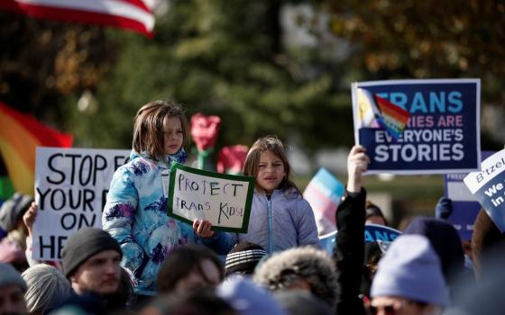 People holding signs. 