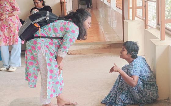 On a visit to a charity home, one of the volunteers strikes a conversation with one of the residents. (Tessy Jacob)