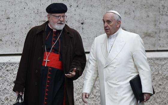 Pope Francis talks with Cardinal Sean O'Malley of Boston as they arrive for a meeting in the synod hall at the Vatican Feb. 13, 2015. O'Malley delivered a lecture, part of the Bergoglio Lecture Series, Feb. 26 at Sacred Heart University. (CNS/Paul Haring)