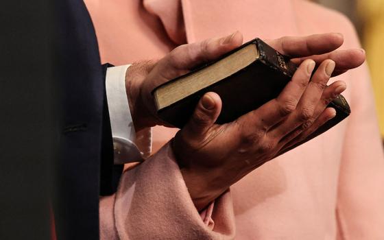 JD Vance takes the oath of office with his hand on a Bible that once belonged to his great-grandmother and is held by his wife, Usha Vance, as he is sworn in as vice president of the United States during inauguration ceremonies in the Rotunda of the U.S. Capitol Jan. 20, 2025, in Washington. (OSV News/Chip Somodevilla, Pool via Reuters)