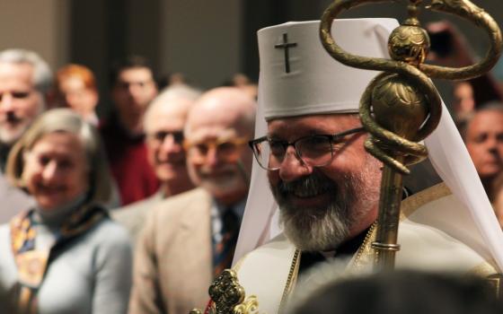 The bishop wears Greek vestments and carries staff.