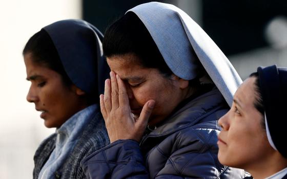 Nuns pray in front of Rome’s Gemelli Hospital Feb. 22, 2025, where Pope Francis is admitted for treatment. The 88-year-old pontiff was in critical condition Feb. 22 after he suffered a prolonged asthmatic respiratory crisis while being treated for pneumonia and a complex lung infection, the Vatican said. 