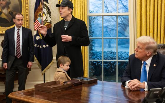 White House staff secretary Will Scharf, Elon Musk and his son X Æ A-Xii are pictured with President Donald Trump at the White House, Feb. 11 in Washington. 