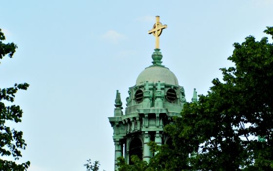 A cross is seen atop a building on the campus of the College of the Holy Cross in Worcester, Massachusetts. (Wikimedia Commons/George Rypysc III)