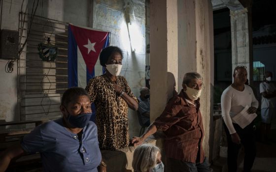 Residents attend a popular consultation to discuss the draft of a new family code, in Havana, Cuba, Friday, Feb. 11, 2022. (AP Photo/Ramon Espinosa)