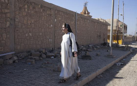 Dominican Sr. Luma Khudher on the streets of Qaraqosh in Iraq in November 2016, a few days after the city was liberated from Islamic State control (NCR photo/Eugenio Grosso)