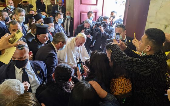 Pope Francis blesses a child amid a crowd of local Syriacs March 7 at the Church of the Immaculate Conception in Qaraqosh, the largest Catholic Church in Iraq. (Xavier Bisits)