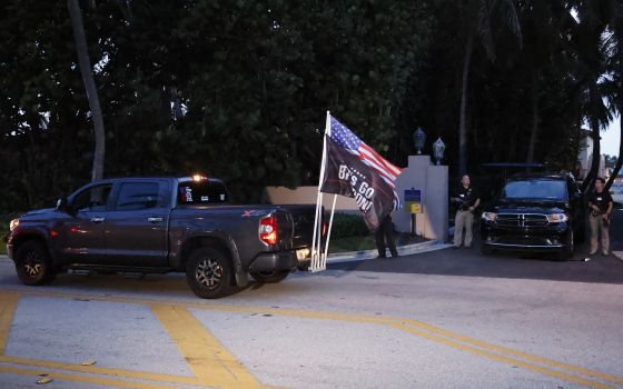 Supporters of former President Donald Trump drive past his Mar-a-Lago estate in Palm Beach, Fla, Aug. 8. The FBI that day conducted a search of his estate, reportedly seeking classified material. (AP/Terry Renna)