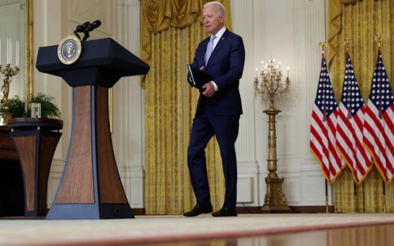 President Joe Biden arrives at the White House in Washington Aug. 12 to discuss his Build Back Better agenda. (CNS/Reuters/Evelyn Hockstein)