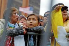 People waiting outside to hear Pope Francis speak at Independence Hall watch on large screens as he celebrates Mass at the nearby cathedral basilica in Philadelphia Sept. 26, 2015. (CNS/Reuters/Jonathan Ernst)