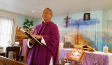 Fr. Rafael Bercasio speaks to tourists gathered for Sunday Mass in late March at El Cristo Rey Chapel in Grand Canyon National Park in Arizona. (CNS/Florida Catholic/Ana Rodriguez-Soto)