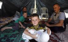 A displaced Iraqi Christian family is seen in 2014 at a camp in Irbil. Mideast Catholic and Orthodox patriarchs have decried the desperate situation they face as shepherds of churches "whose existence is in real danger." (CNS/EPA/Ahmed Jalill)