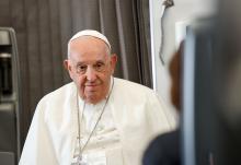 Pope Francis listens to a question from a journalist aboard his flight back to Rome Sept. 13, after visiting Indonesia, Papua New Guinea, Timor-Leste (or East Timor) and Singapore. It was his 45th and longest foreign trip. (CNS photo/Lola Gomez)