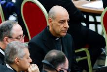 Cardinal Víctor Manuel Fernández, prefect of the Dicastery for the Doctrine of the Faith, listens to Benedictine Mother Maria Ignazia Angelini’s intervention during the morning synod session in the Paul VI Audience Hall at the Vatican Oct. 15. (CNS/Lola Gomez)