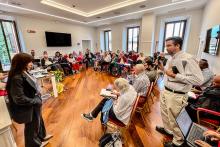 Emilce Cuda, secretary at the Pontifical Commission for Latin America, and Kevin Ahern, Manhattan University theology professor, speak at a session of the Lay Mission and Vocation Conference in Rome on Oct. 11. (NCR photo/Camillo Barone)