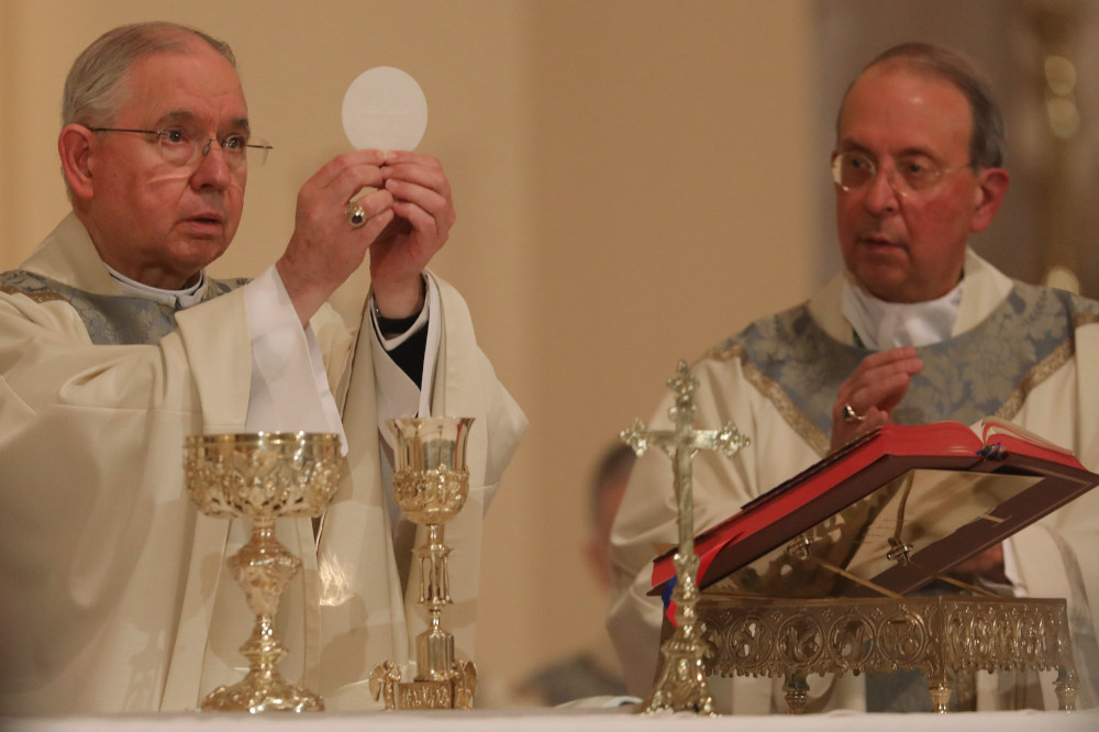 Archbishop José Gomez of Los Angeles, president of the U.S. Conference of Catholic Bishops, concelebrates Mass with Archbishop William Lori of Baltimore Nov. 15 in Baltimore. (CNS/Bob Roller)