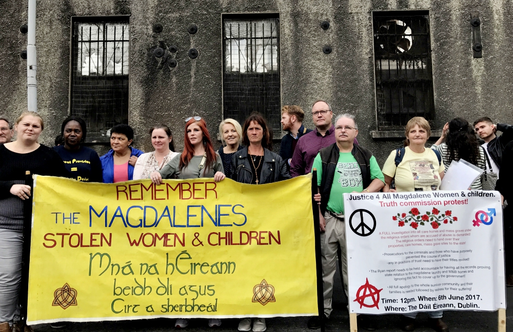 Survivors and their supporters demonstrate on Aug. 25, 2017, at a near-derelict former Magdalene laundry in Dublin. (Newscom/ZUMA Press/Ed Carty)